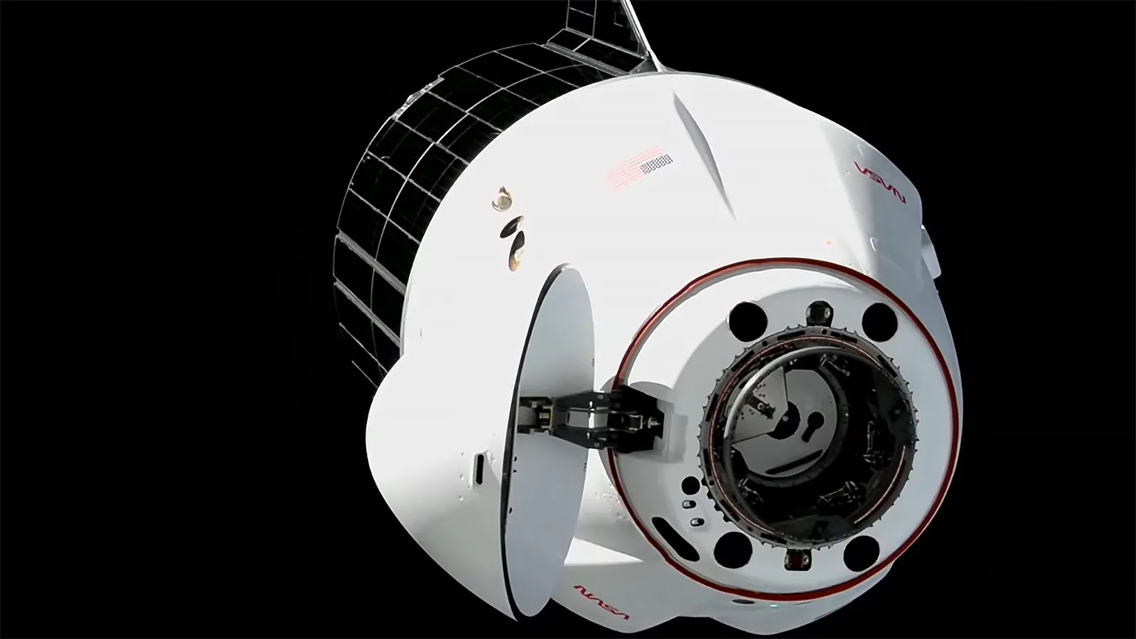 SpaceX Dragon Docks with Science, Supplies, and Roll-Out Solar Arrays