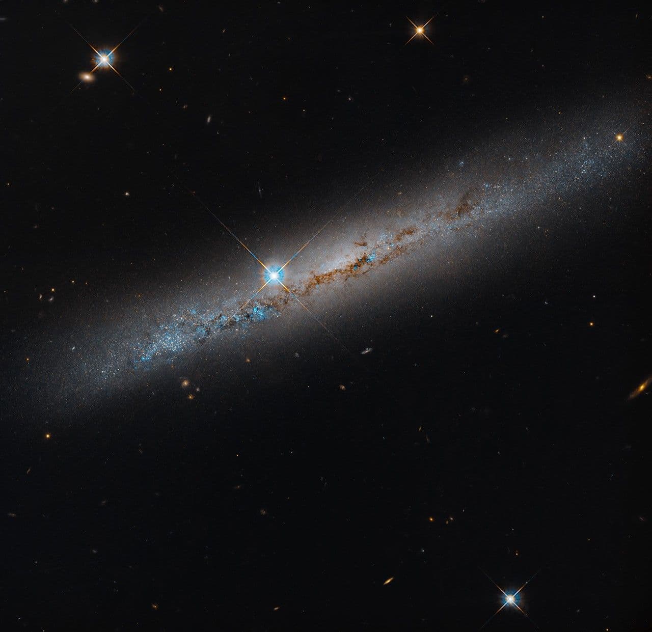 NASA’s Hubble Spies Spiral’s Edge
